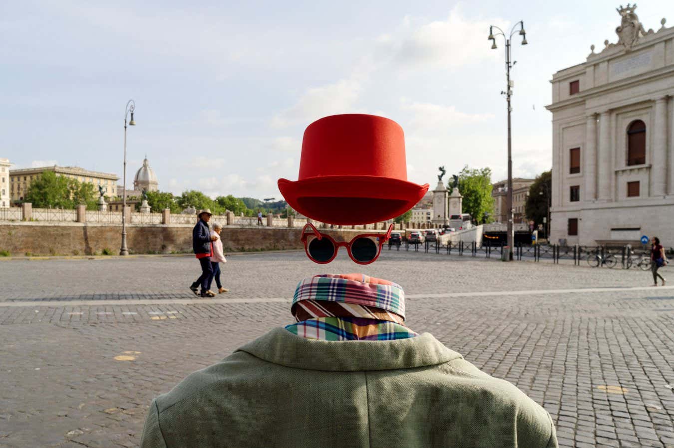 RC9MHB Rome, Italy, 05/06/2018: a street artist simulates an invisible man on the pedestrian area along tevere castello near castel sant