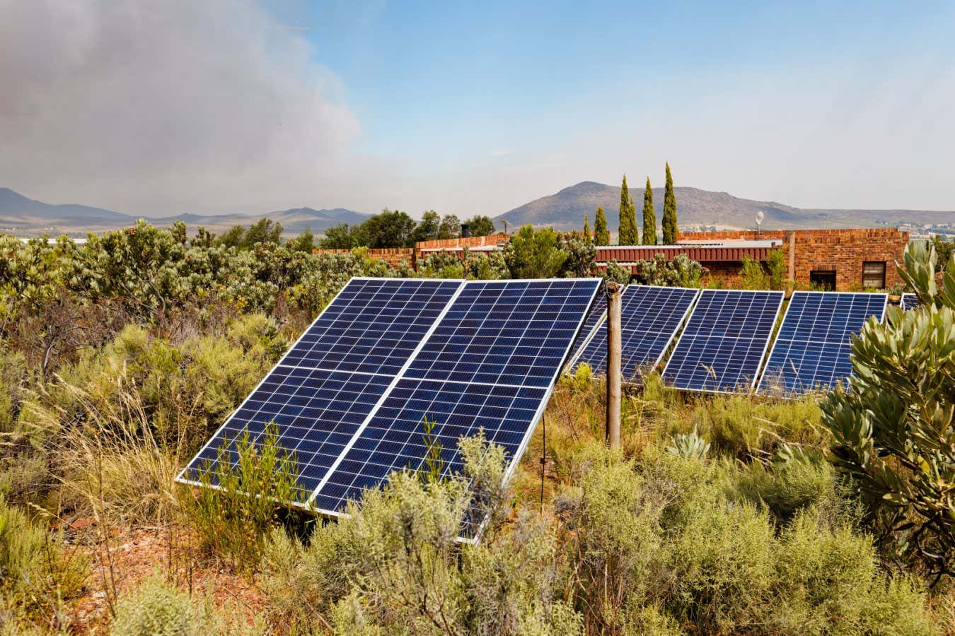Solar panels installed in wild brush land near Worcester, Western Cape, South Africa.