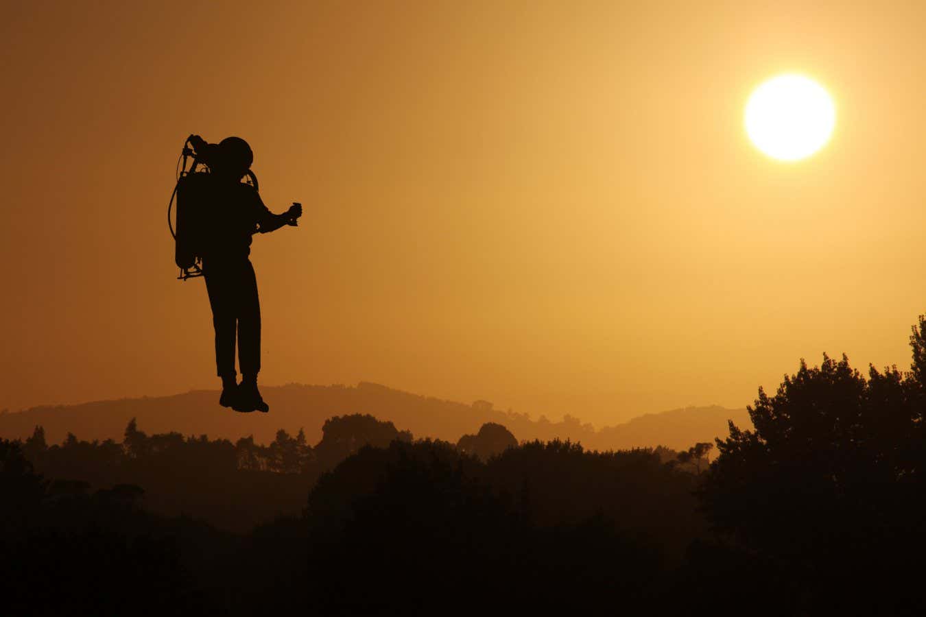 A series of retouched illustrated images of a silhouette of a rocket jetpack man flying in the sky at sunset. There are a range of positioning of the rocket man to suit your needs. Medium distance composition. The rocket man is an illustration put on a background image of the sunset. The rocket man illustration is an illustration that I drew in photoshop. You will see that it is just a flat shape with no tone or detail, but because it is a silhouette against the sky, it works well. The illustration is a traced illustration from a photographic origin and I took the original photo so I understand that I am the sole copyright holder. I have attached it for you to view in the releases upload as requested.