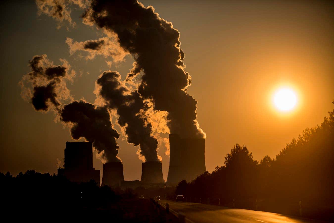 BOXBERG, GERMANY - MARCH 17: Boxberg Power Station is seen during sunset on March 17, 2016 in Boxberg, Germany. This lignite-fired power station is the second largest in Germany. (Photo by Florian Gaertner/Photothek via Getty Images)